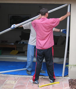 For sliding patio doors, the original frame has to be removed. This can usually be done without causing any damage to exterior stucco or siding.