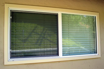 Our new vinyl replacement windows from the inside and the outside.